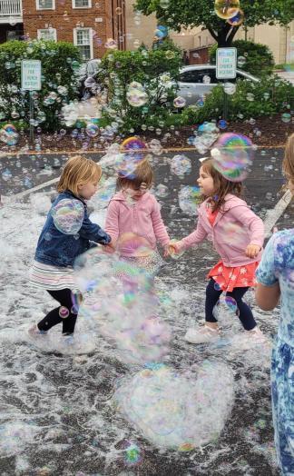 Children playing with bubbles