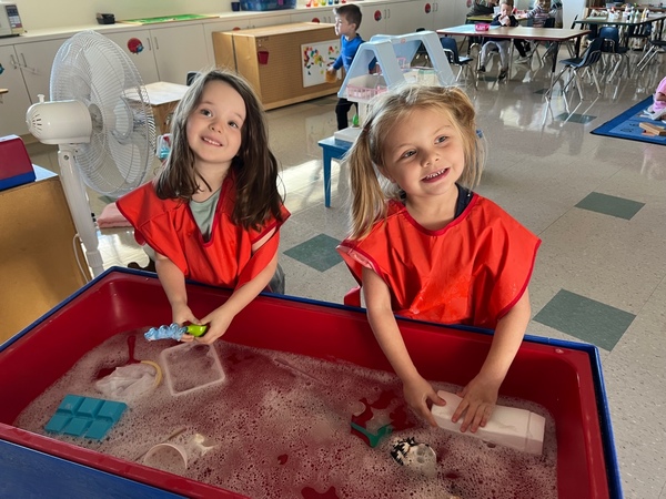 Children playing in a water table