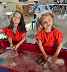 Children playing in a water table