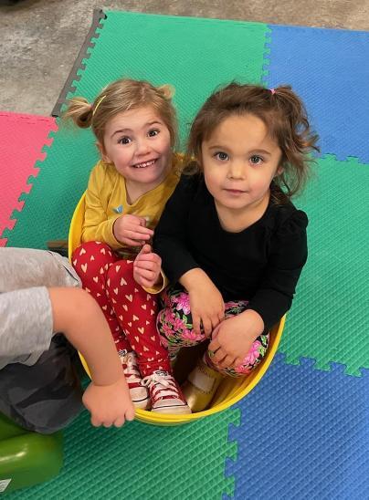 Children sitting in a basket